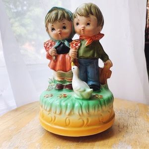 Vintage Hummel-esque boy and girl music with duck music box